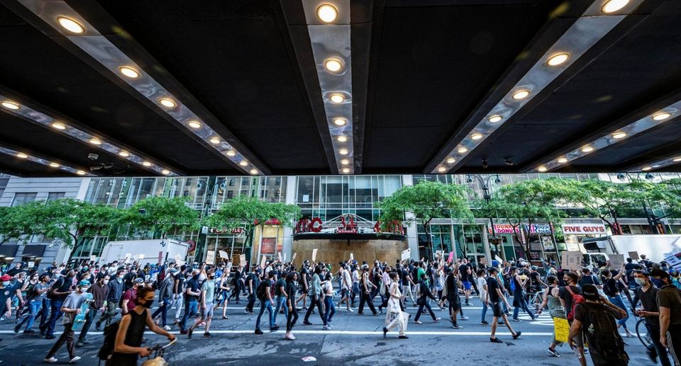 Protesters rallying through the streets of NYC in