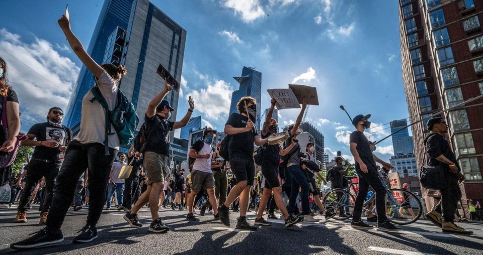 Protesters rallying through the streets of NYC in