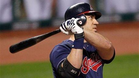 The Cleveland Indians' Travis Hafner watches his two-run