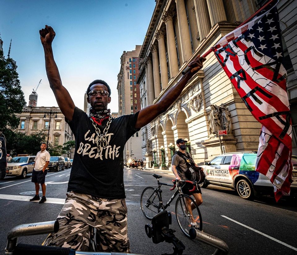 Protester holding the American flag in Manhattan during