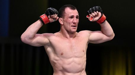 Merab Dvalishvili reacts after the conclusion of his