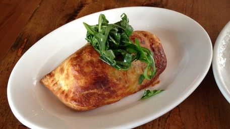 Empanada with pork and ginger at Salumi in
