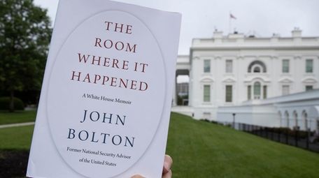 A copy of "The Room Where It Happened,"