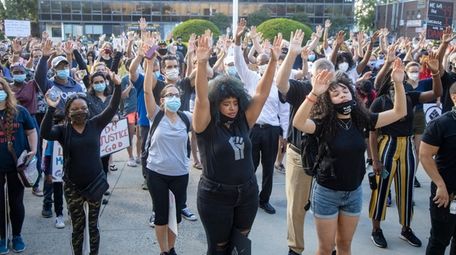 Racially and ethnically diverse demonstrators protest against police