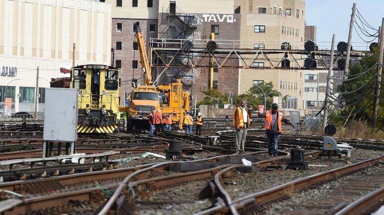 MTA workers try to get work train back