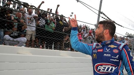 Fans cheer for Bubba Wallace, driver of the