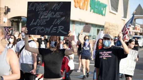 Protesters march and demonstrate against police brutality in