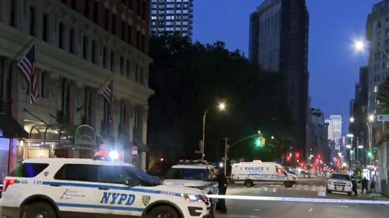 NYPD vehicles at the scene Friday of a