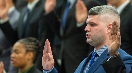 Michael Alvarez at the swearing-in ceremony for recruits