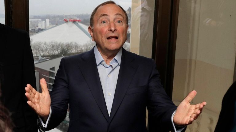 NHL Commissioner Gary Bettman talks to visitors at