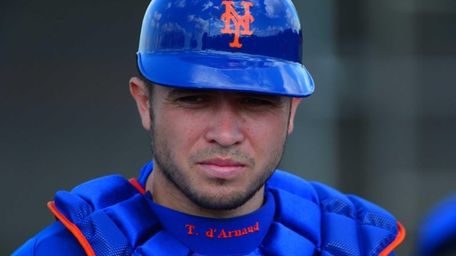 Travis d'Arnaud looks on during a spring training