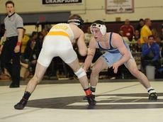 Rocky Point's Tommy Dutton wrestles Kings Park's Tom