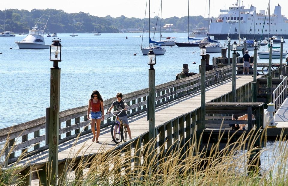 By foot and by bike, people stroll along