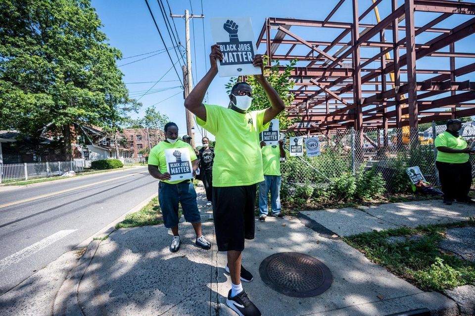 Protesters gathered at Rhodes School Construction Site in