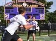 Sayville quarterback Jack Cheshire throws to a teammate