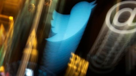 The Twitter logo appears on an updated phone