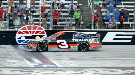 Austin Dillon crosses the finish line to win
