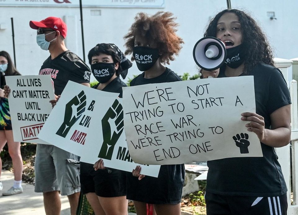 Protestors March against racism and police brutality on