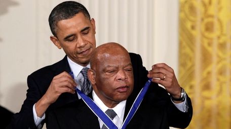 President Barack Obama presents the Presidential Medal of