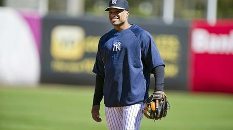 Robinson Cano smiles on the field during his