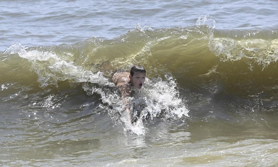Jeff Bracy, 12, of East Northport, cools off