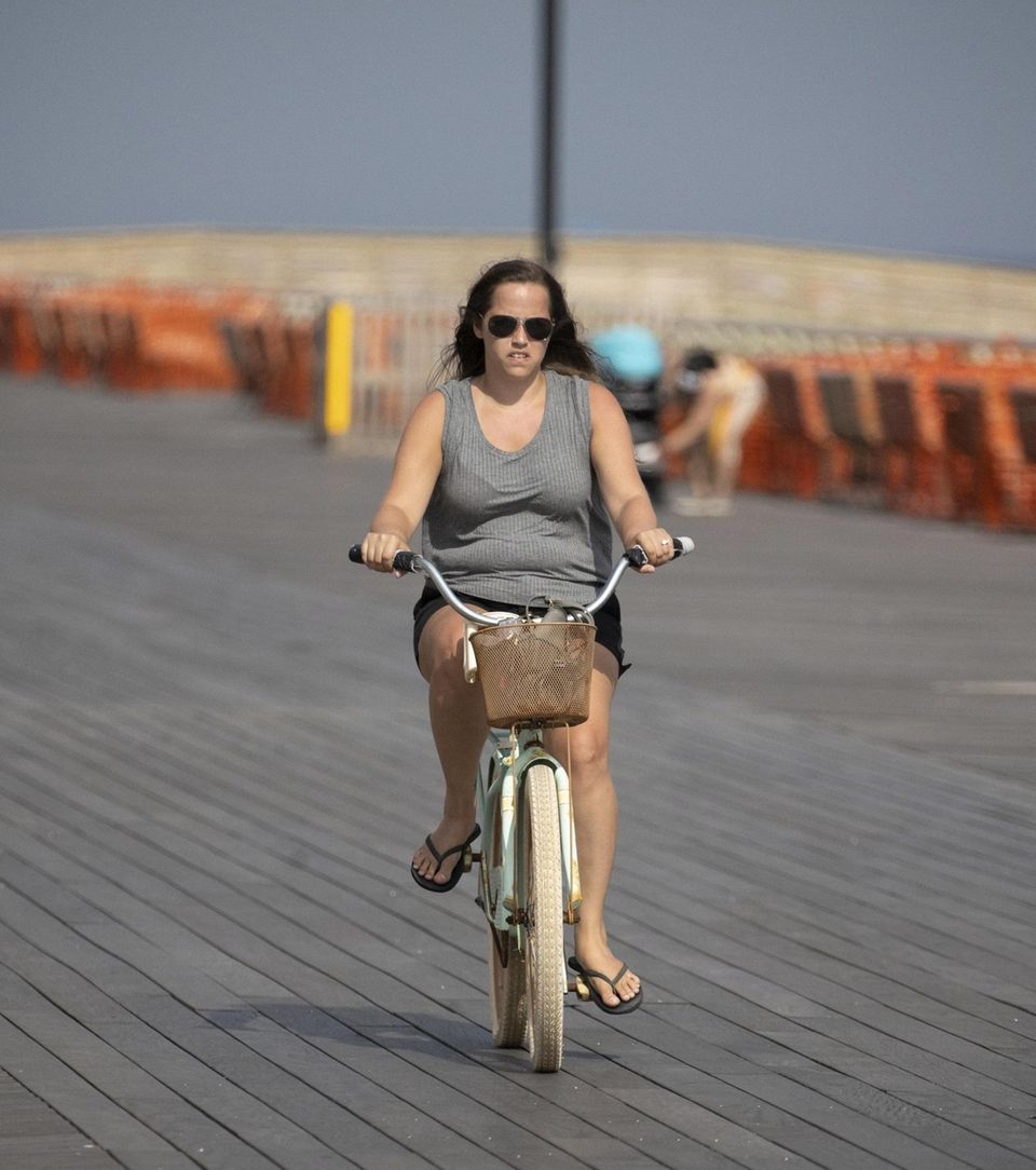 People hit the beach during the heatwave as