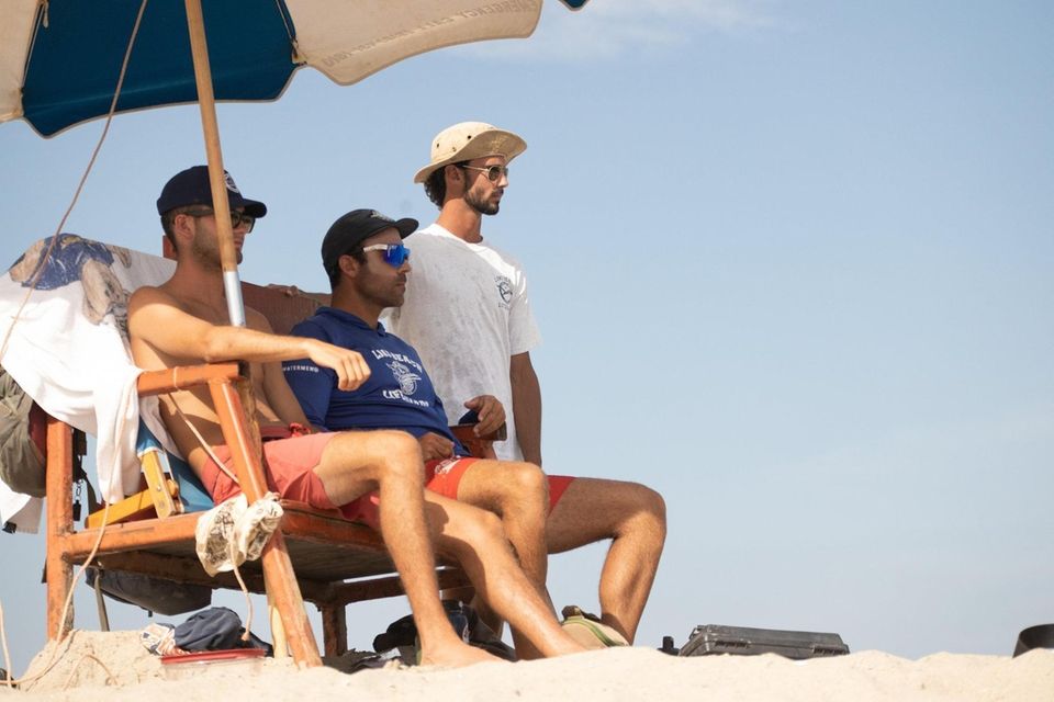 Long Beach lifeguards (left to right) Brendan Stark,