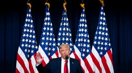 President Donald Trump speaks before signing executive orders