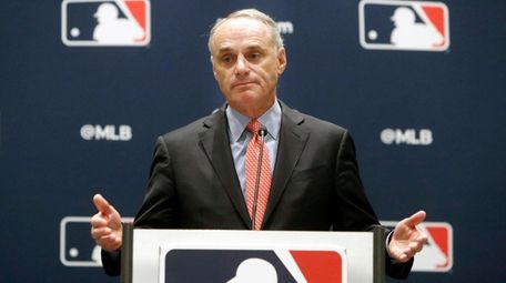 Baseball commissioner Rob Manfred speaks to the media