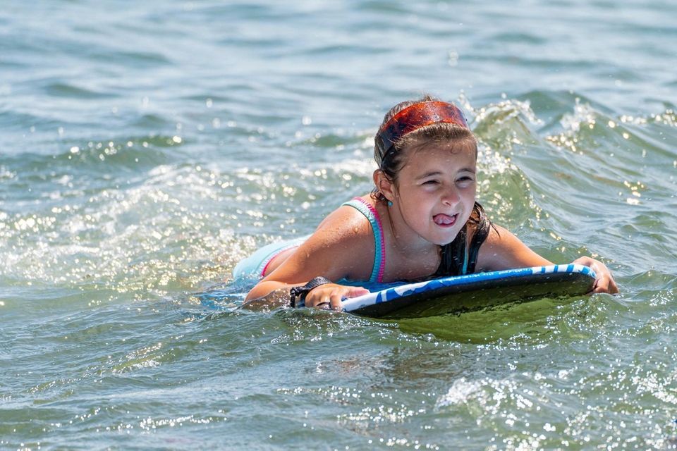 Demi Aggelatos, 7, from Mineola keep cool in