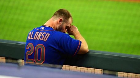 Pete Alonso #20 of the Mets watches play