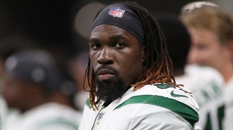 Jets linebacker C.J. Mosley (57) looks up from