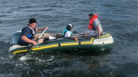 Three men on a raft in Long Island