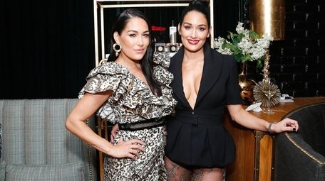Twins Brie, left, and Nikki Bella have each