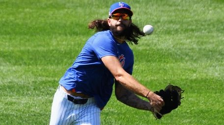 Mets relief pitcher Robert Gsellman throws during an