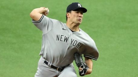Masahiro Tanaka of the Yankees throws against the