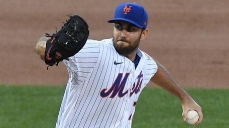 Mets starting pitcher David Peterson delivers against the