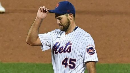 Mets starting pitcher Michael Wacha stands on the