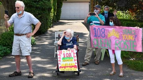 Rosalia Zona, who turned 108, watches a birthday