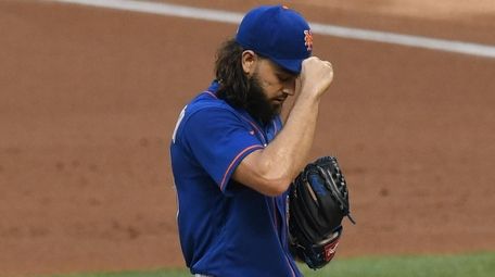 Mets starting pitcher Robert Gsellman stands on the