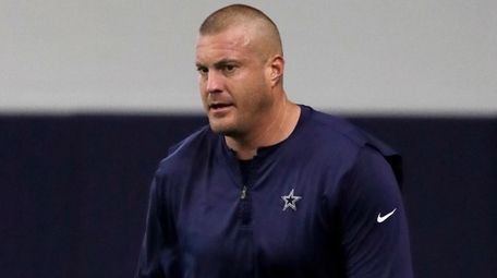 Then-Cowboys offensive line coach Marc Colombo participates in