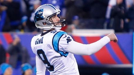 Graham Gano, then with the Panthers, follows through