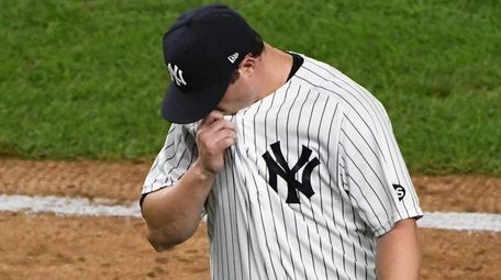 Yankees relief pitcher Zack Britton walks to the