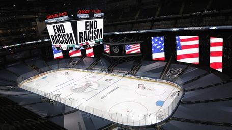 "End Racism" is displayed on the scoreboard in