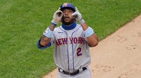 New York Mets' Dominic Smith celebrates after hitting