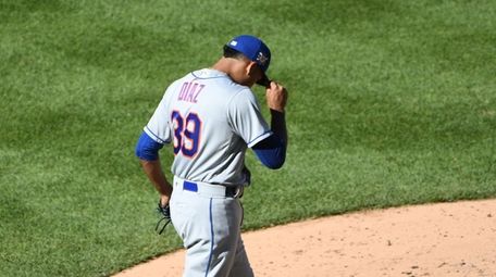 Mets relief pitcher Edwin Diaz reacts against the