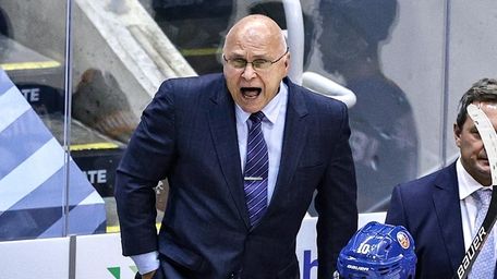 Islanders head coach Barry Trotz reacts against the