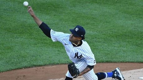 Yankees starting pitcher Deivi Garcia delivers against the