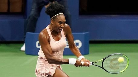Venus Williams returns a shot to Karolina Muchova