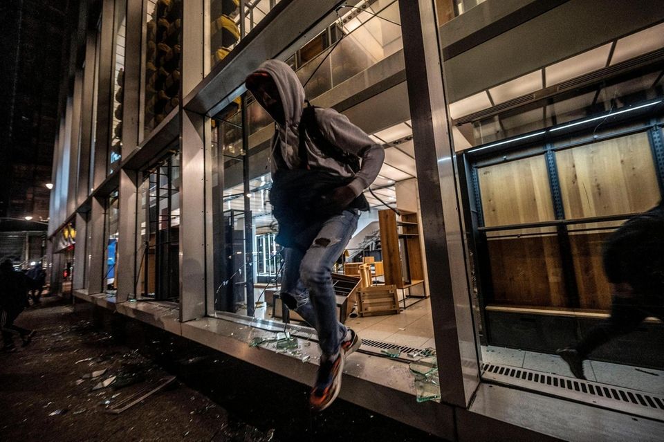 People run out of stores on Broadway with